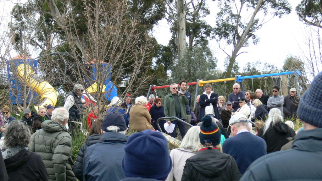 Speaking at a local community rally